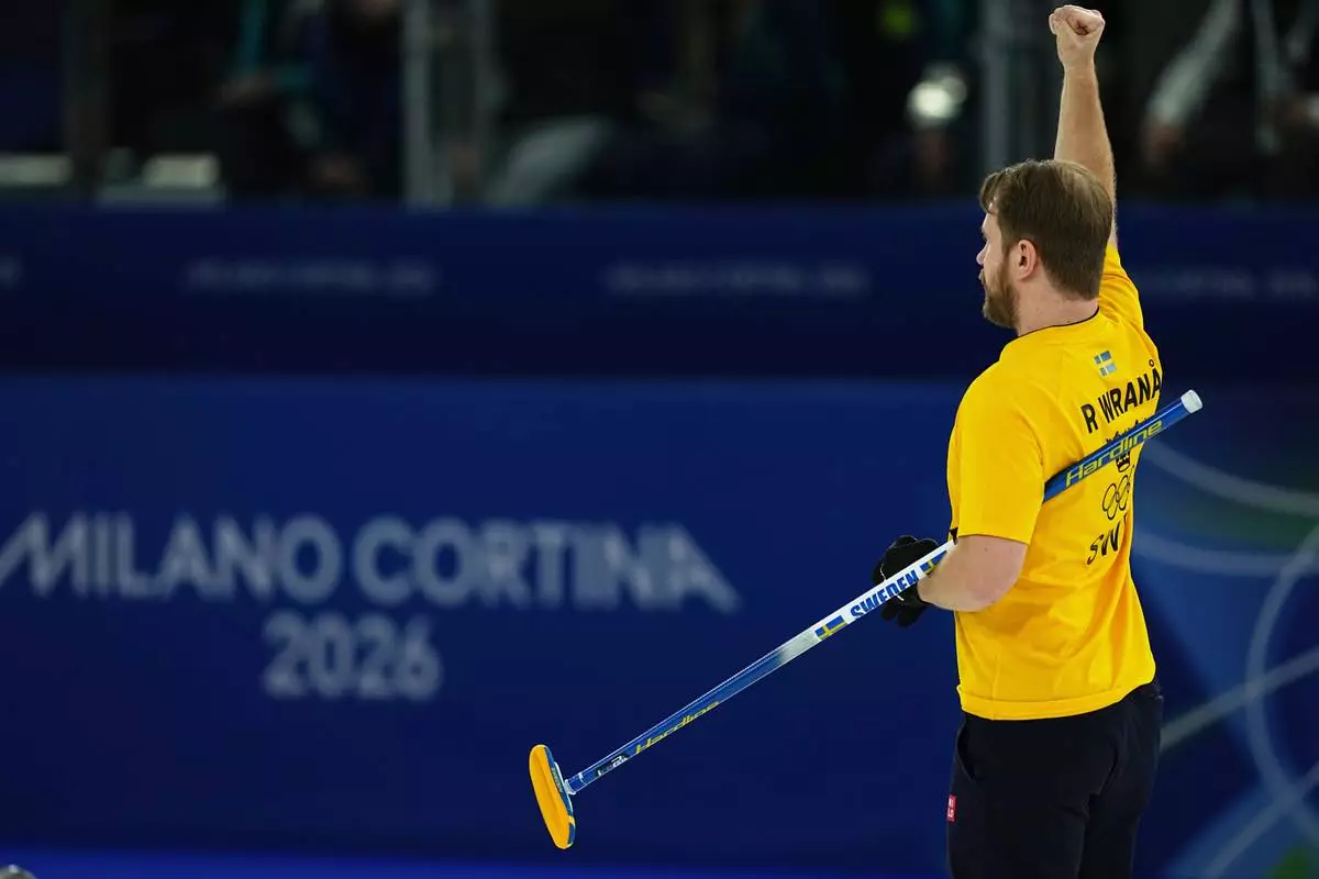 Sweden's Rasmus Wranaa reacts during the semi-finals round of the mixed doubles curling match against Britain, at the 2026 Winter Olympics, in Cortina d'Ampezzo, Italy, Monday, Feb. 9, 2026. (AP Photo/Fatima Shbair)
