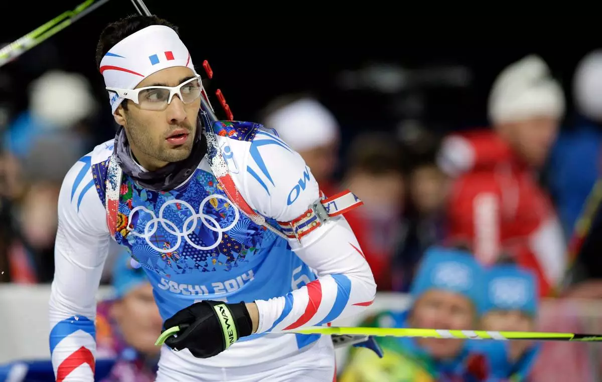 FILE - France's Martin Fourcade approaches the shooting range during the men's biathlon 4x7.5K relay at the 2014 Winter Olympics, Saturday, Feb. 22, 2014, in Krasnaya Polyana, Russia. (AP Photo/Lee Jin-man, File)