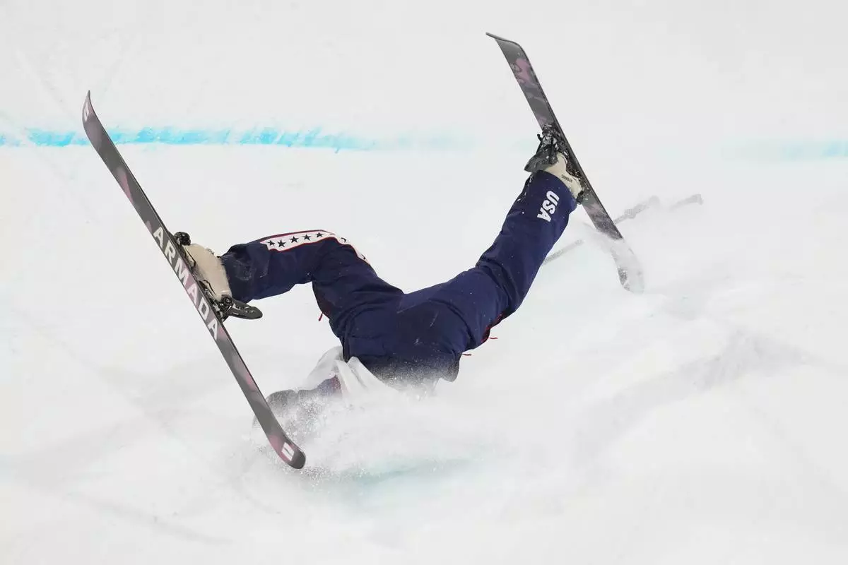 United States' Rell Harwood falls as she competes in the women's freestyle skiing big air qualifications at the 2026 Winter Olympics, in Livigno, Italy, Saturday, Feb. 14, 2026. (AP Photo/Abbie Parr)
