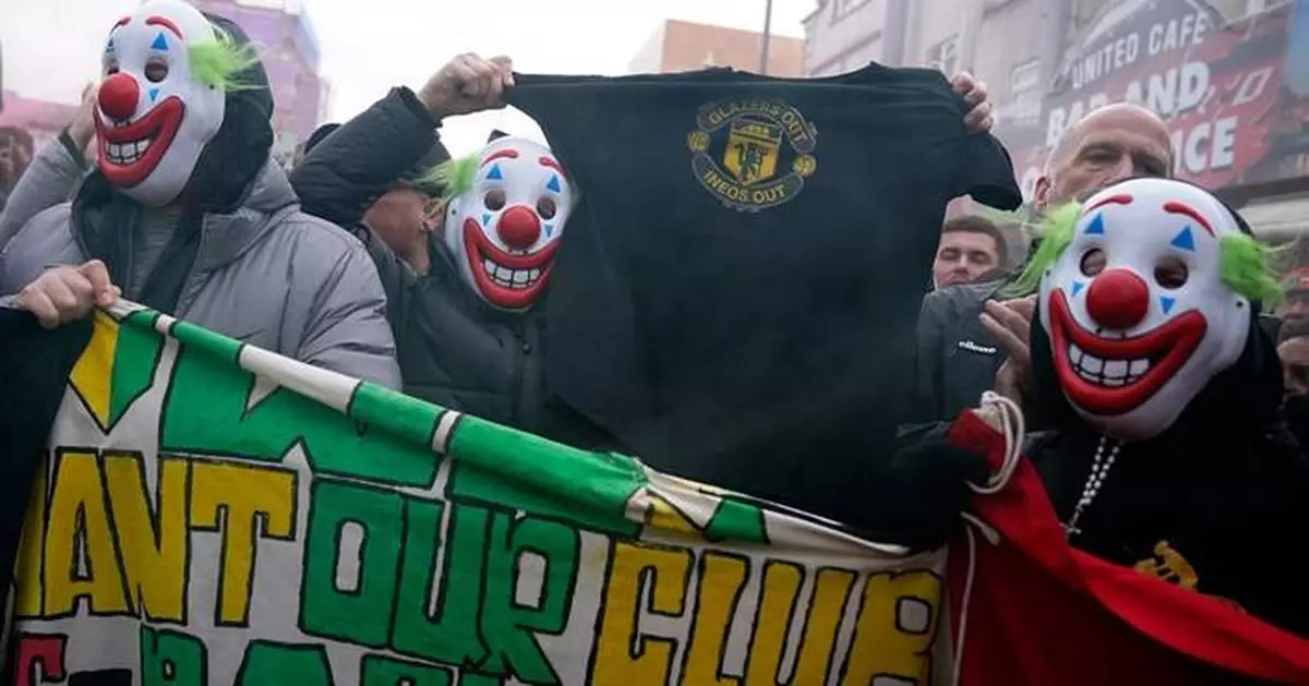 Man United fans wear clown masks in latest protest at club's owners