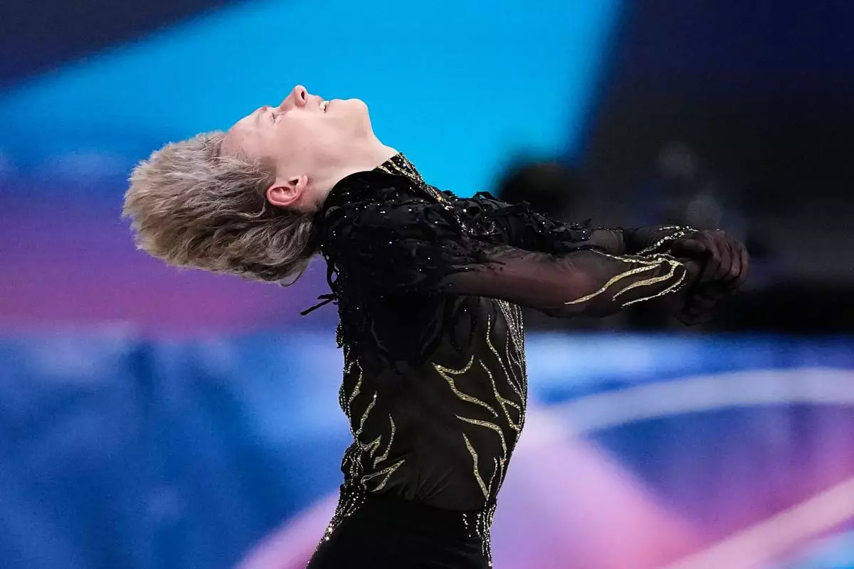Ilia Malinin of the United States competes during the men's free skate program in figure skating at the 2026 Winter Olympics, in Milan, Italy, Friday, Feb. 13, 2026. (AP Photo/Natacha Pisarenko)