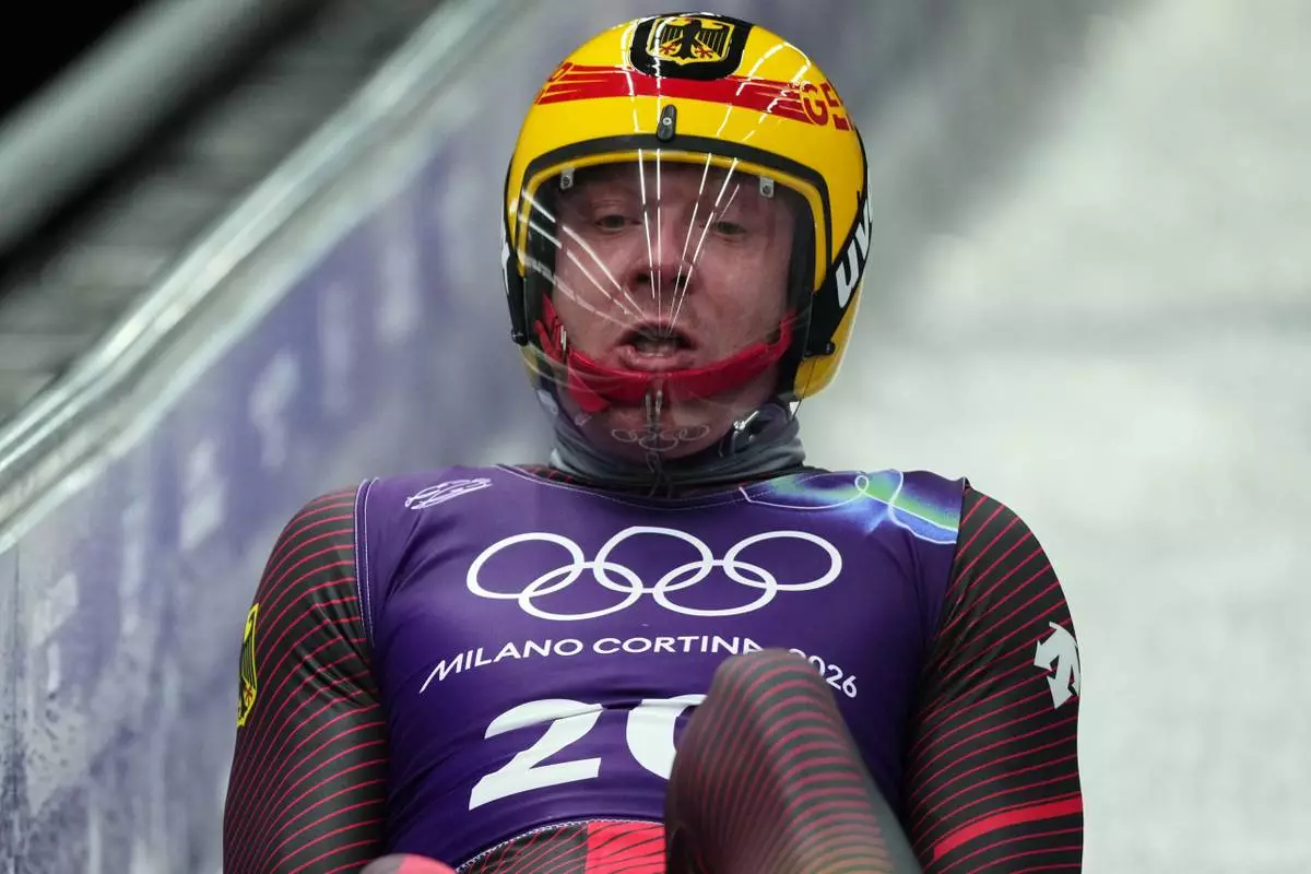 at the 2026 Winter Olympics, in Cortina d'Ampezzo, Italy, Thursday, Feb. 5, 2026. (AP Photo/Alessandra Tarantino)