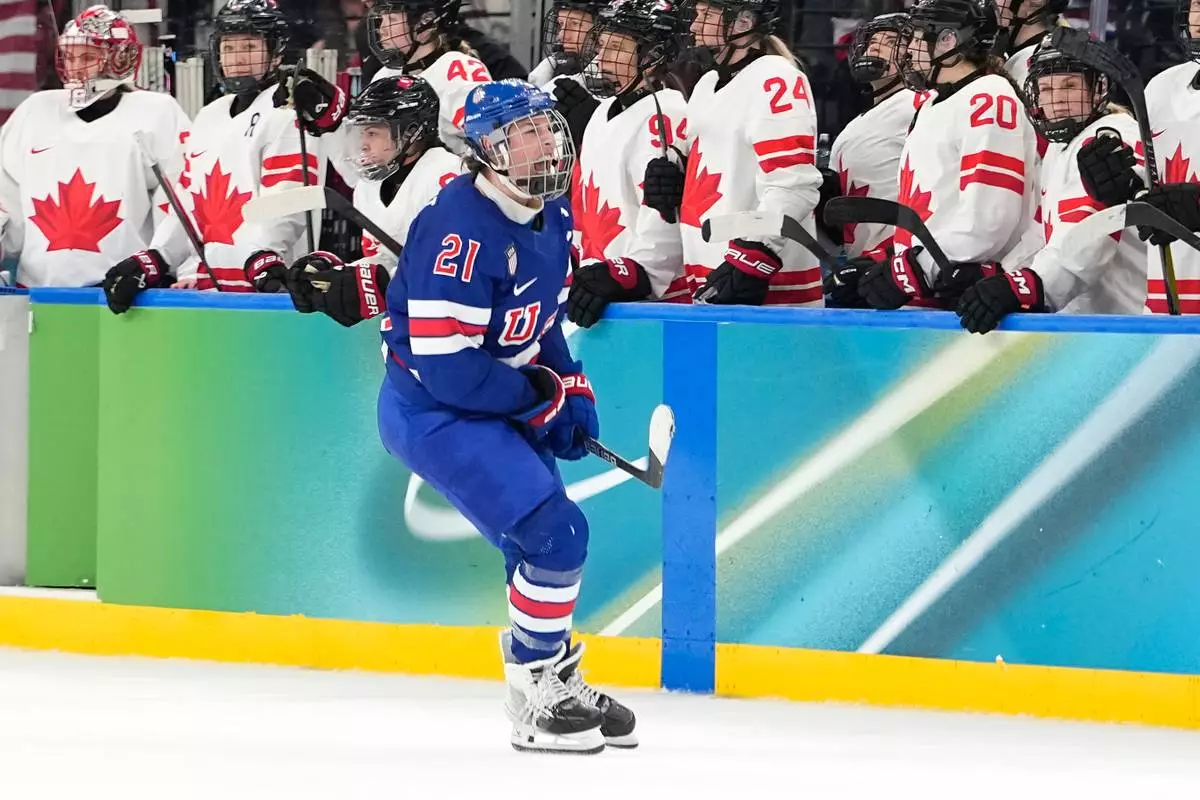 United States' Hilary Knight (21) celebrates after scoring her side's opening goal during a women's ice hockey gold medal game between the United States and Canada at the 2026 Winter Olympics, in Milan, Italy, Thursday, Feb. 19, 2026. (AP Photo/Hassan Ammar)