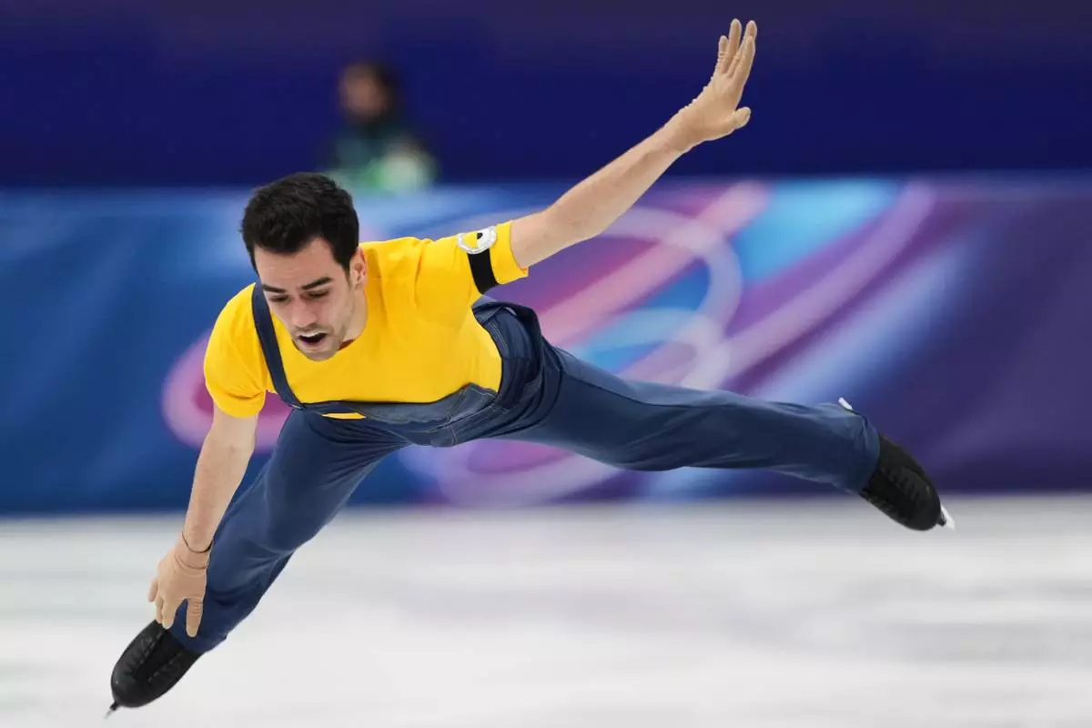 Tomas Guarino Sabate of Spain competes during the men's figure skating short program at the 2026 Winter Olympics, in Milan, Italy, Tuesday, Feb. 10, 2026. (AP Photo/Francisco Seco)