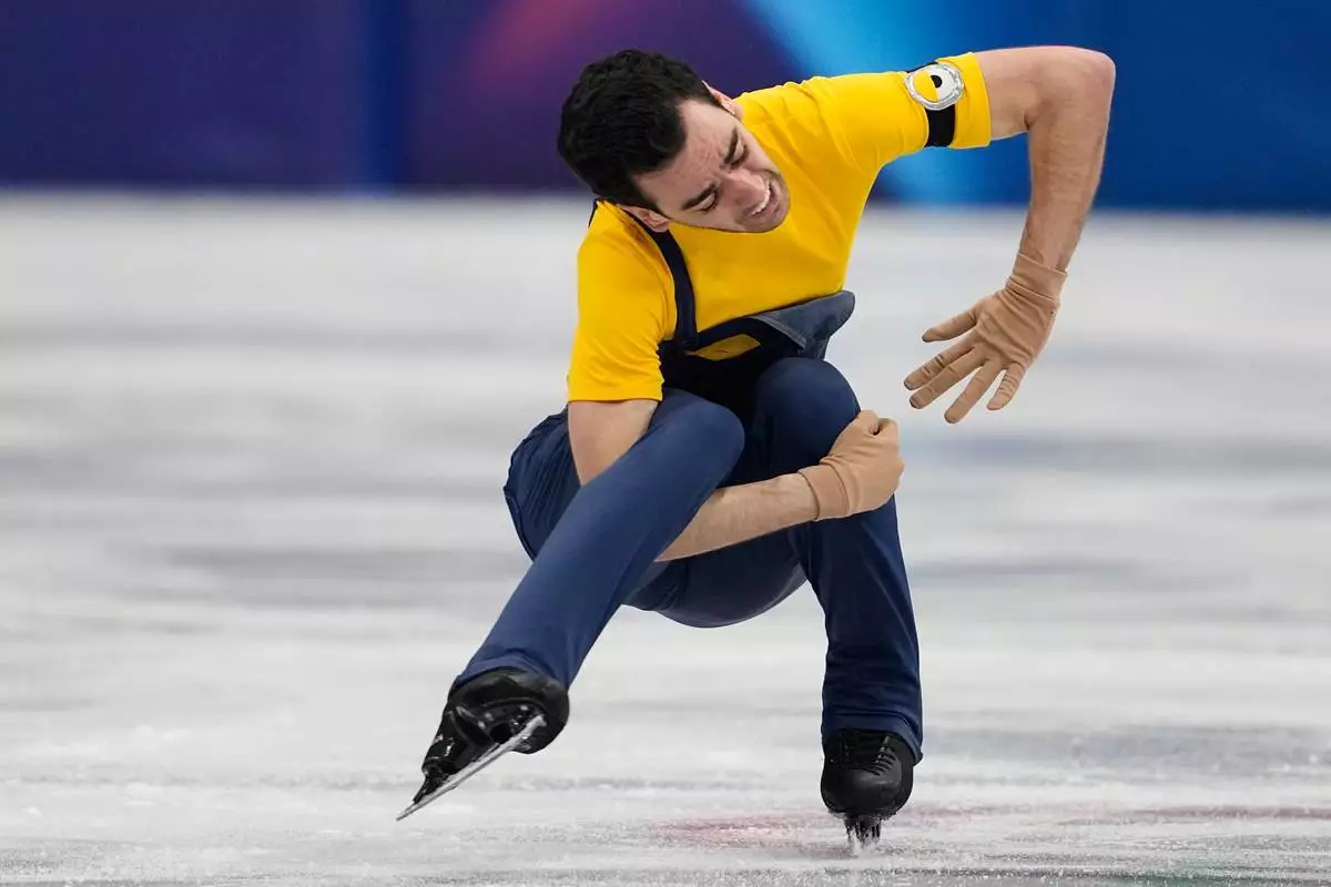Tomas Guarino Sabate of Spain competes during the men's figure skating short program at the 2026 Winter Olympics, in Milan, Italy, Tuesday, Feb. 10, 2026. (AP Photo/Ashley Landis)