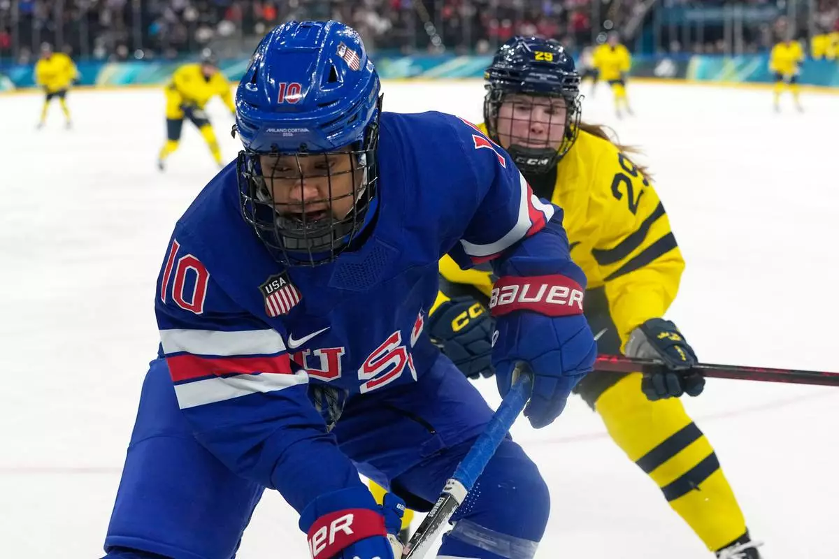 United States' Laila Edwards (10) challenges with Sweden's Felizia Wikner Zienkiewicz (29) during a women's ice hockey semifinal game between the United States and Sweden at the 2026 Winter Olympics, in Milan, Italy, Monday, Feb. 16, 2026. (AP Photo/Hassan Ammar)