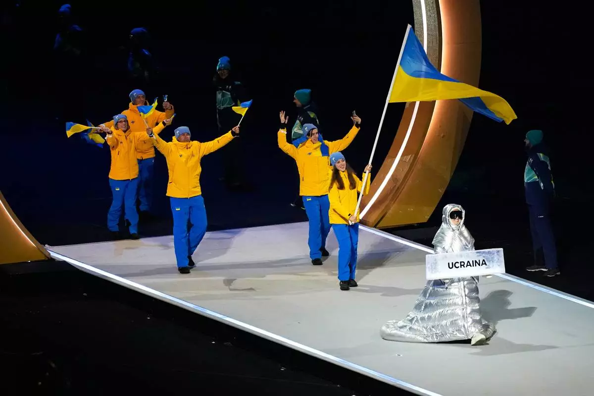 Athletes from Ukraine attend the Olympic opening ceremony at the 2026 Winter Olympics, in Milan, Italy, Friday, Feb. 6, 2026. (AP Photo/Petr David Josek)