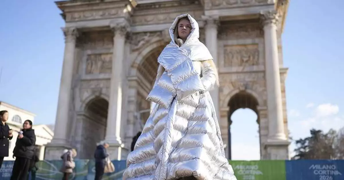 Russian woman carries Ukraine placard at Winter Olympics opening ceremony
