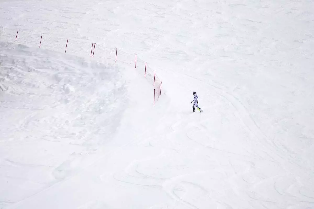 Norway's Atle Lie McGrath walks off the course after skiing out during an alpine ski, men's slalom race, at the 2026 Winter Olympics, in Bormio, Italy, Monday, Feb. 16, 2026. (AP Photo/John Locher)