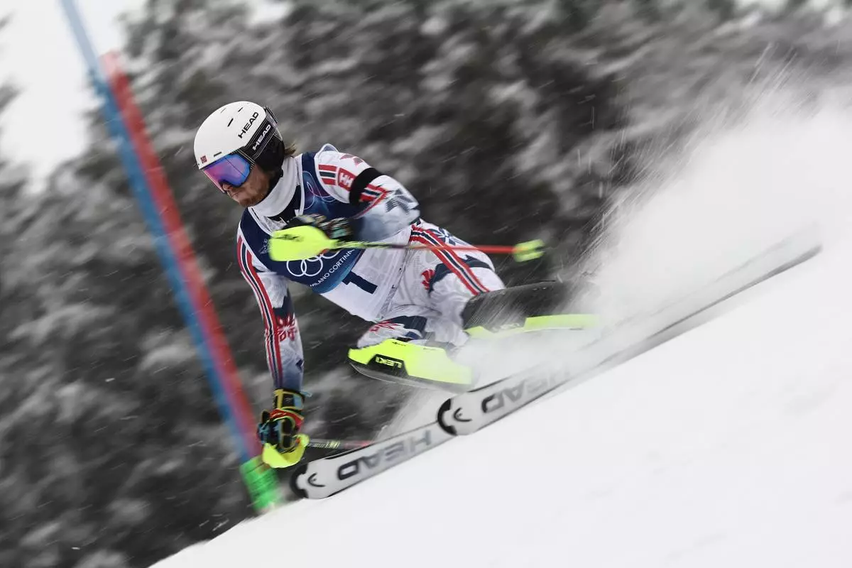 Norway's Atle Lie McGrath speeds down the course, during an alpine ski, men's slalom race, at the 2026 Winter Olympics, in Bormio, Italy, Monday, Feb. 16, 2026. (AP Photo/Gabriele Facciotti)