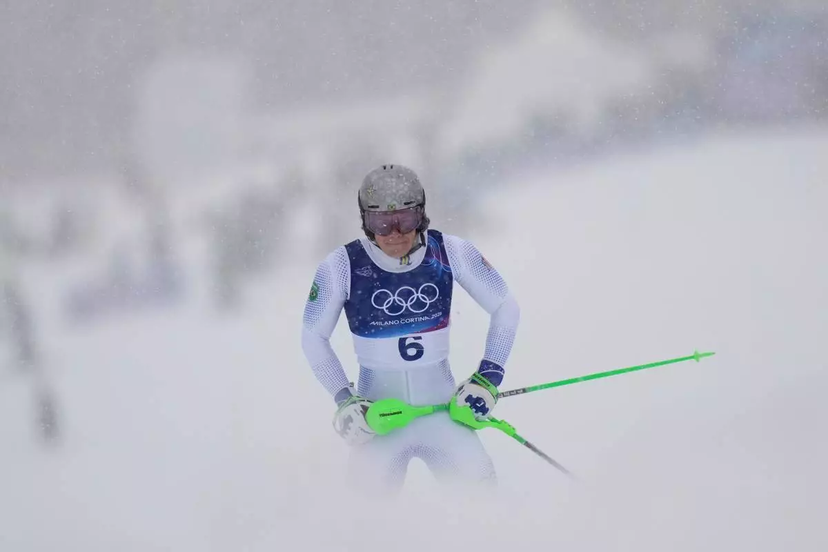Brazil's Lucas Pinheiro Braathen reacts after crashing during an alpine ski, men's slalom race, at the 2026 Winter Olympics, in Bormio, Italy, Monday, Feb. 16, 2026. (AP Photo/Julia Demaree Nikhinson)