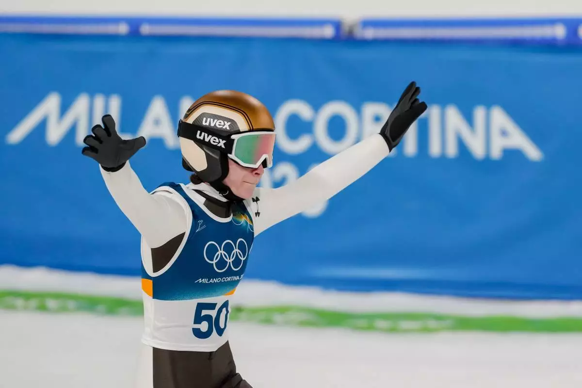 Nika Prevc, of Slovenia, reacts after her final round jump of the ski jumping women's normal hill individual, at the 2026 Winter Olympics, in Predazzo, Italy, Saturday, Feb. 7, 2026. (AP Photo/Evgeniy Maloletka)
