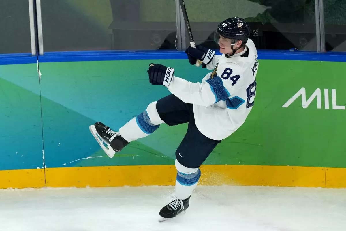 Finland's Kaapo Kakko celebrates after scoring a goal against Slovakia during the third period of the men's ice hockey bronze medal game at the 2026 Winter Olympics in Milan, Italy, Saturday, Feb. 21, 2026. (AP Photo/Carolyn Kaster)