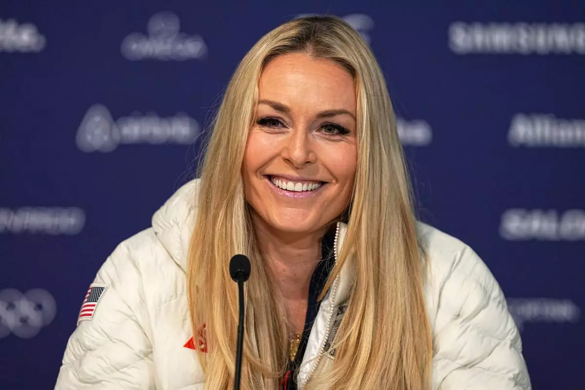 United States' Lindsey Vonn smiles during a press conference by the U.S. ski team at the 2026 Winter Olympics, in Cortina d'Ampezzo, Italy, Tuesday, Feb. 3, 2026. (AP Photo/Fatima Shbair)