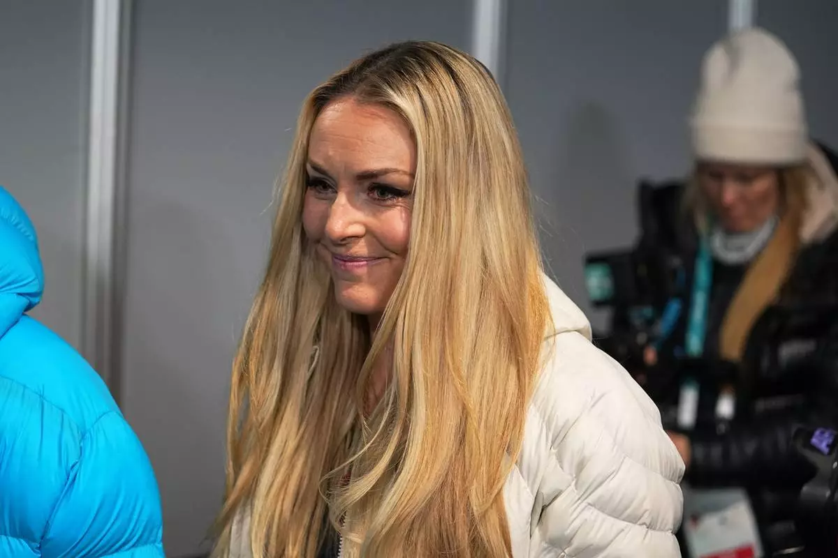 United States' Lindsey Vonn leaves after a press conference by the U.S. ski team at the 2026 Winter Olympics, in Cortina d'Ampezzo, Italy, Tuesday, Feb. 3, 2026. (AP Photo/Fatima Shbair)