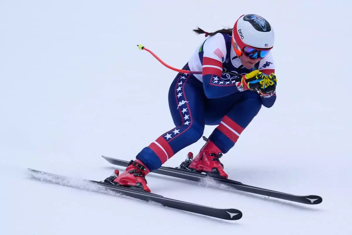 United States' Breezy Johnson speeds down the course during an alpine ski, downhill portion of a women's team combined race, at the 2026 Winter Olympics, in Cortina d'Ampezzo, Italy, Tuesday, Feb. 10, 2026. (AP Photo/Robert F. Bukaty)