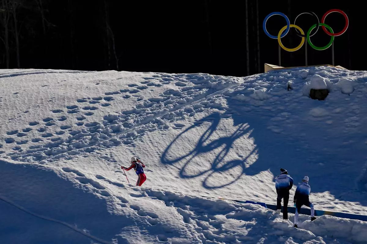 Johannes Hoesflot Klaebo, of Norway, skis uphill during the cross country skiing men's 4 x 7.5km relay at the 2026 Winter Olympics, in Tesero, Italy, Sunday, Feb. 15, 2026. (AP Photo/Matthias Schrader)
