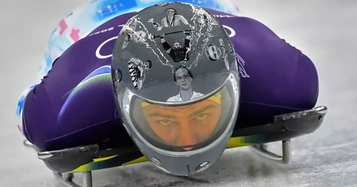Ukrainian trains in helmet honoring fellow athletes killed in war. IOC says it's banned for race