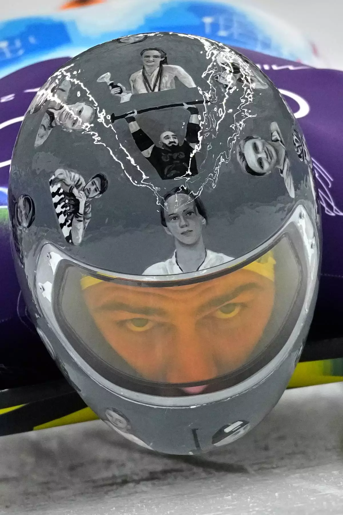 Ukraine's Vladyslav Heraskevych starts a men's skeleton training session at the 2026 Winter Olympics, in Cortina d'Ampezzo, Italy, Monday, Feb. 9, 2026. (AP Photo/Alessandra Tarantino)