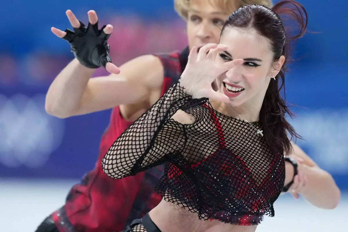 Diana Davis and Gleb Smolkin of Georgia compete during the figure skating ice dance team event at the 2026 Winter Olympics, in Milan, Italy, Friday, Feb. 6, 2026. (AP Photo/Stephanie Scarbrough)