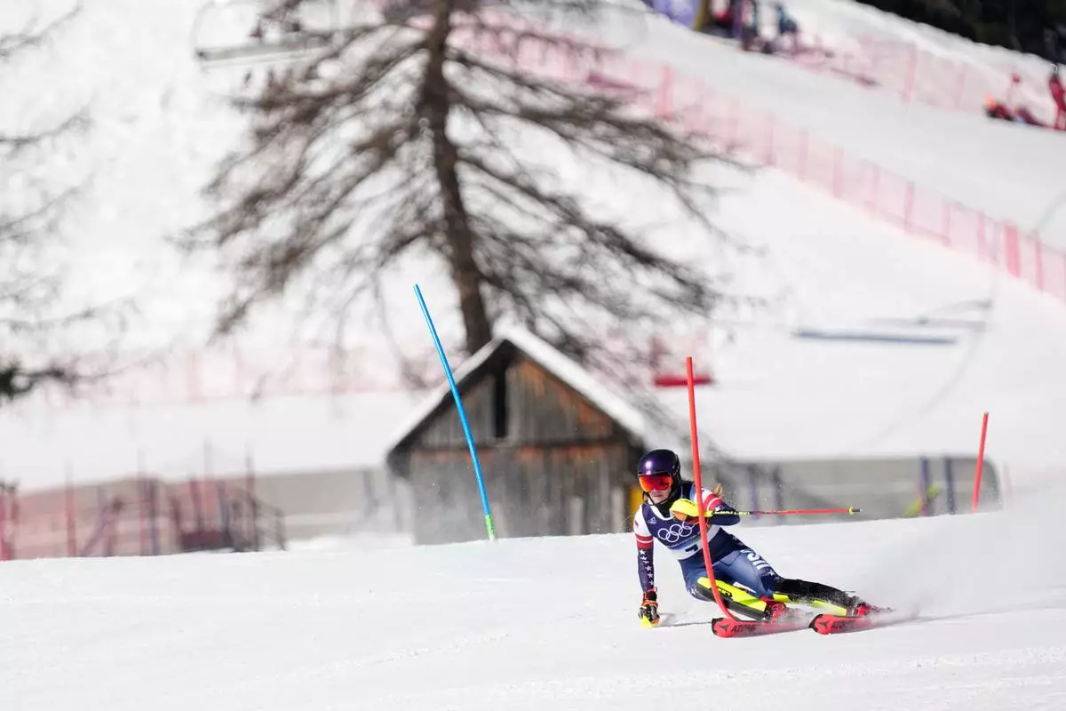 United States' Mikaela Shiffrin competes in at the finish area of an alpine ski, women's slalom race, at the 2026 Winter Olympics, in Cortina d'Ampezzo, Italy, Wednesday, Feb. 18, 2026. (AP Photo/Andy Wong)