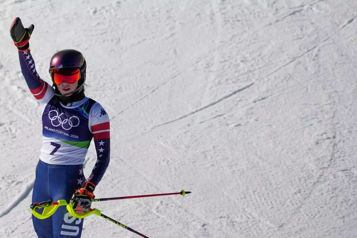 United States' Mikaela Shiffrin celebrates winning an alpine ski, women's slalom race, at the 2026 Winter Olympics, in Cortina d'Ampezzo, Italy, Wednesday, Feb. 18, 2026. (AP Photo/Andy Wong)
