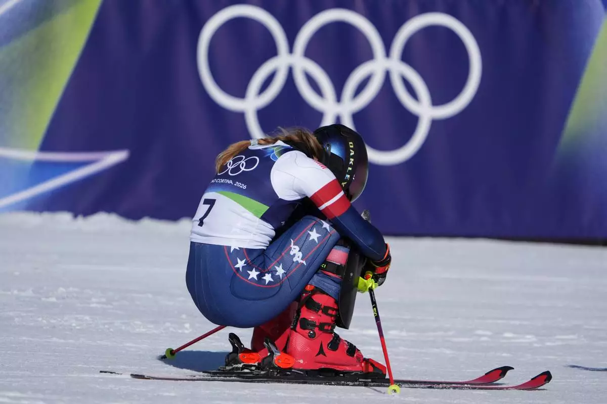 United States' Mikaela Shiffrin celebrates at the finish area of an alpine ski, women's slalom race, at the 2026 Winter Olympics, in Cortina d'Ampezzo, Italy, Wednesday, Feb. 18, 2026. (AP Photo/Jacquelyn Martin)