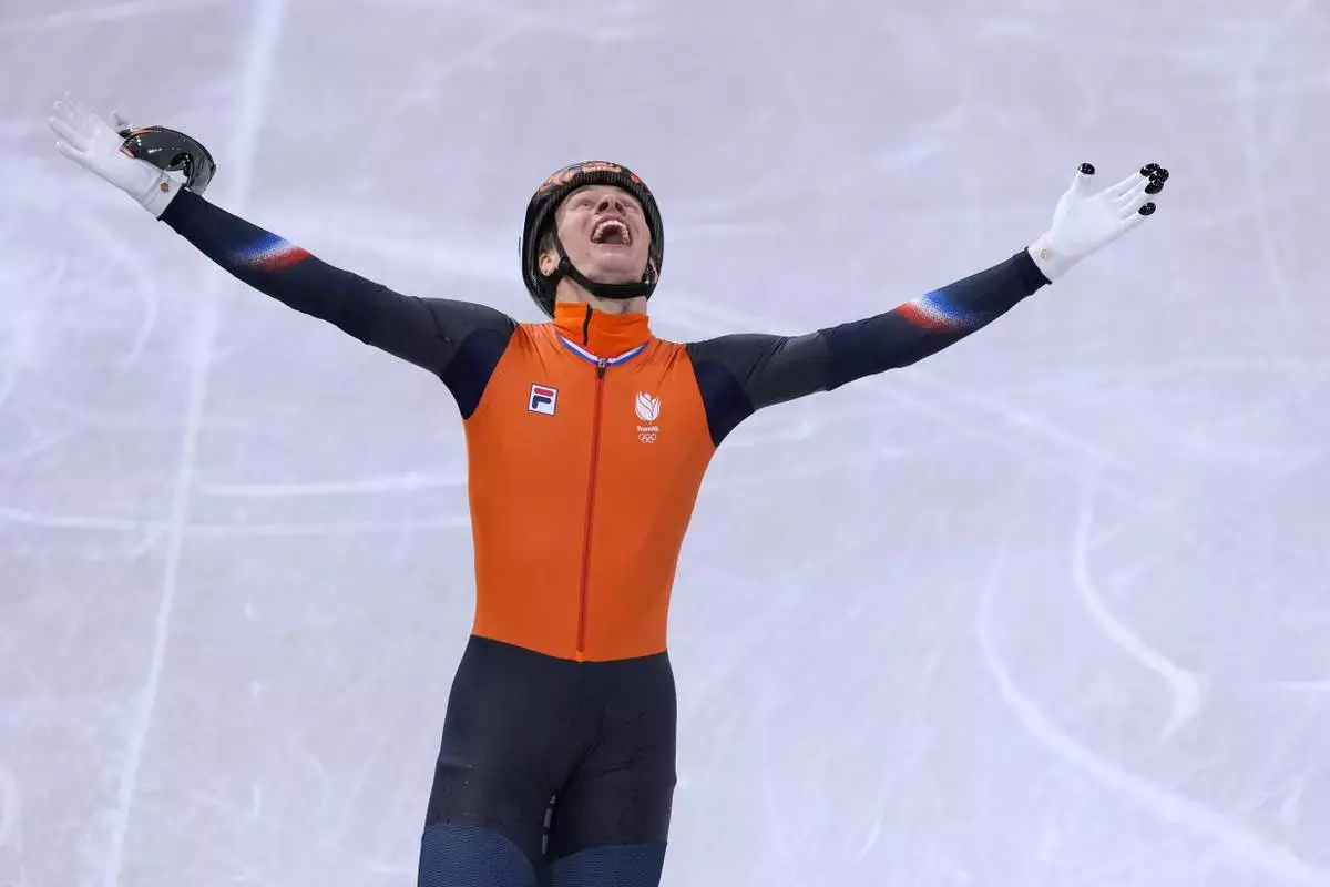 Jens van 't Wout of the Netherlands wins gold during the short track speed skating men's 1000m at the 2026 Winter Olympics, in Milan, Italy, Thursday, Feb. 12, 2026. (AP Photo/Stephanie Scarbrough)