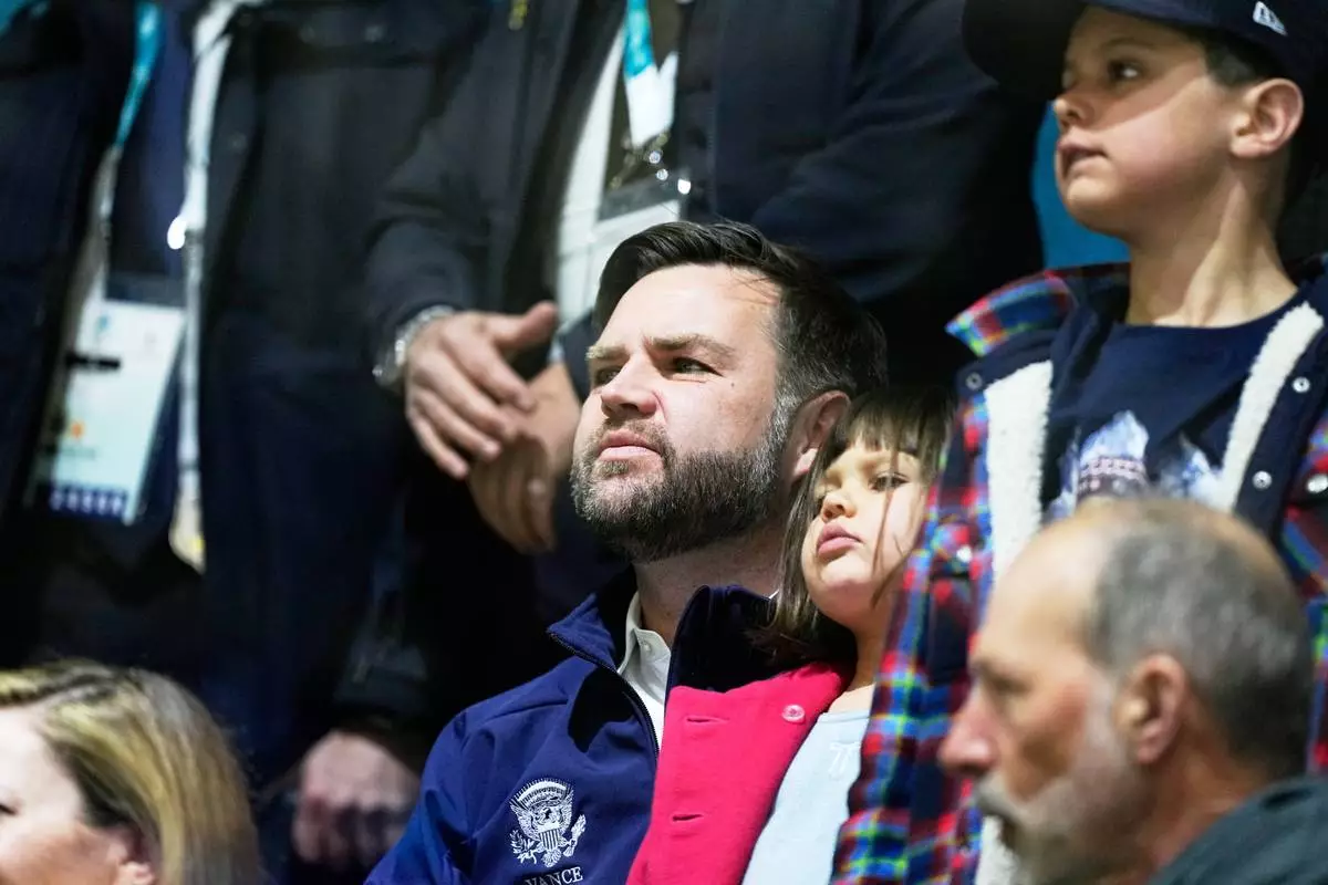 Vice President JD Vance, center, attends a preliminary round match of women's ice hockey between United States and Czechia at the 2026 Winter Olympics, in Milan, Italy, Thursday, Feb. 5, 2026. (AP Photo/Petr David Josek)