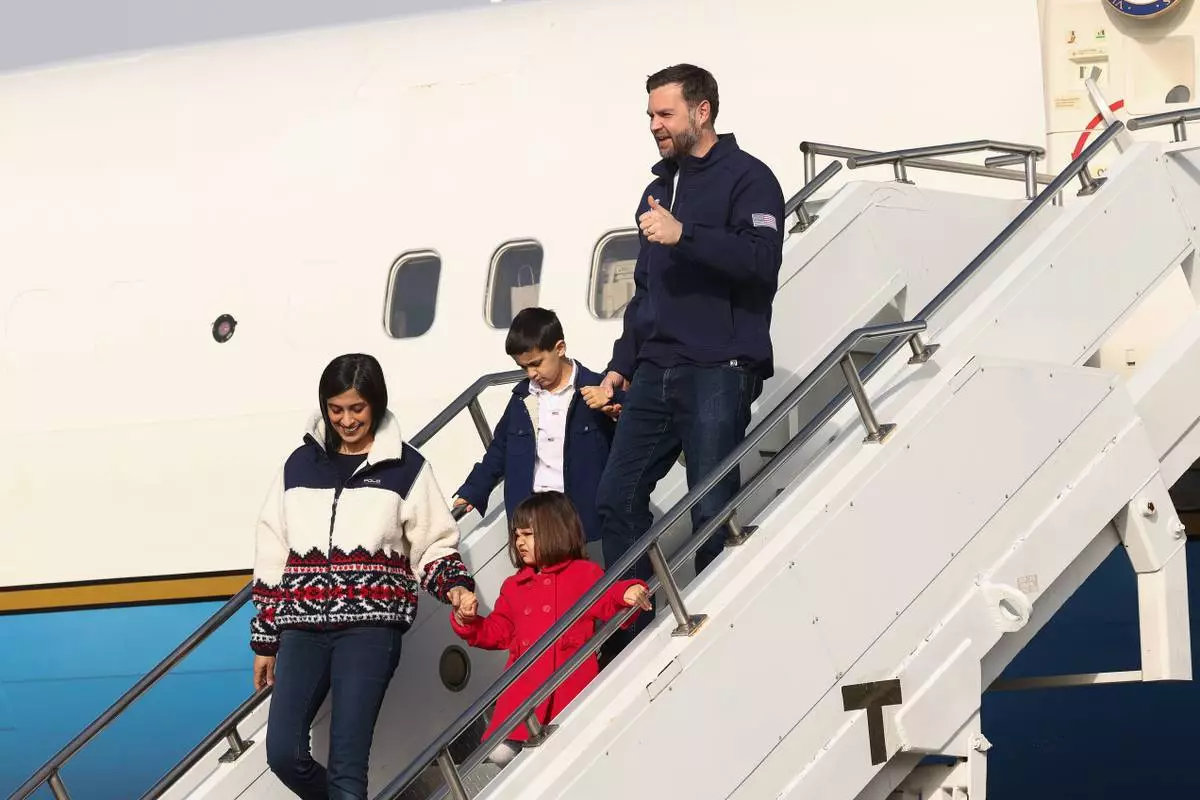 Vice President JD Vance, second lady Usha Vance and their children Mirabel and Vivek disembark Air Force Two as they arrive ahead of the Milano Cortina 2026 Winter Olympics in Milan, Italy, Thursday, Feb. 5, 2026. (Kevin Lamarque/Pool Photo via AP)