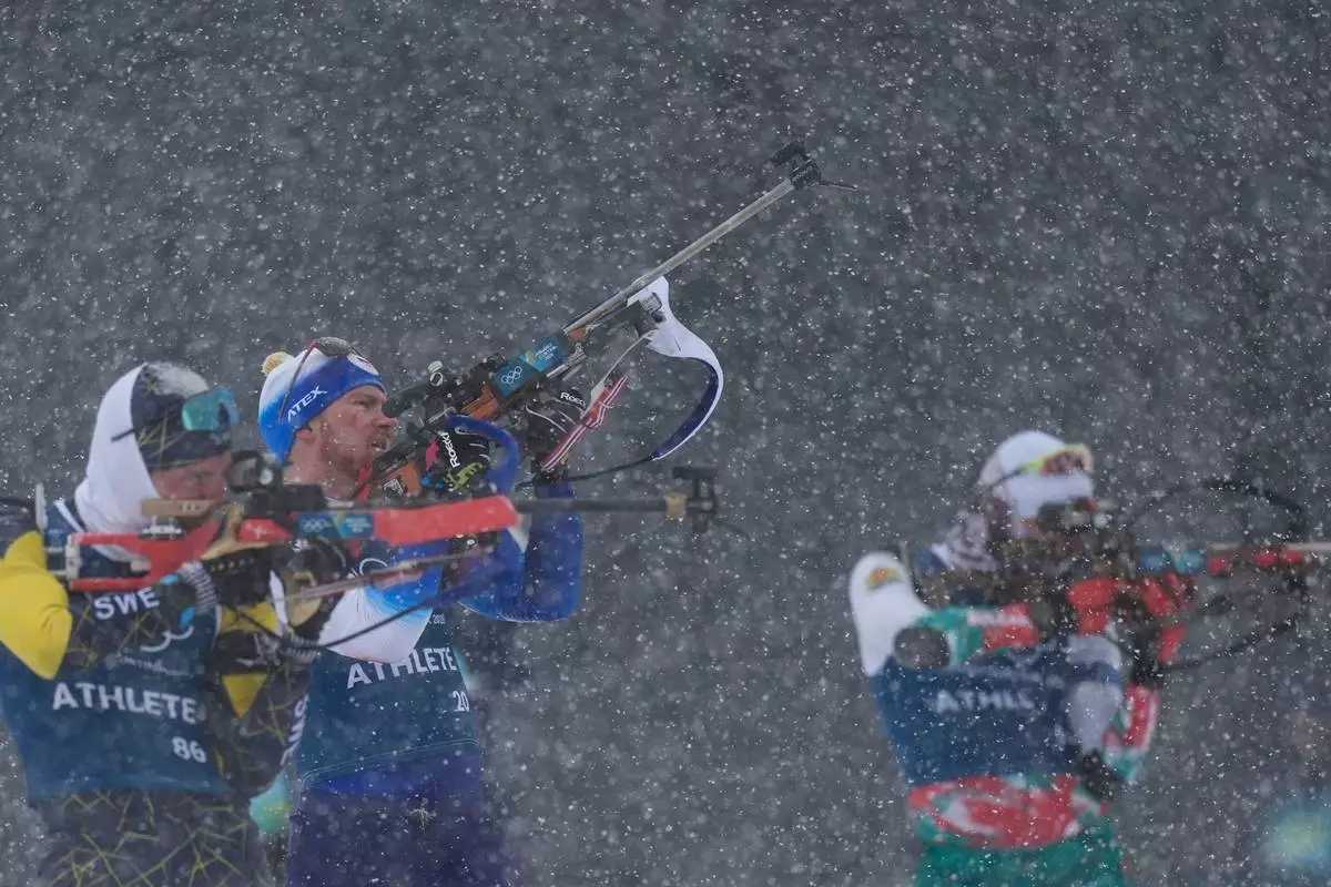 Vitezslav Hornig, of Czechia, center, participates in a biathlon training session at the 2026 Winter Olympics in Anterselva, Italy, Thursday, Feb. 19, 2026. (AP Photo/Andrew Medichini)