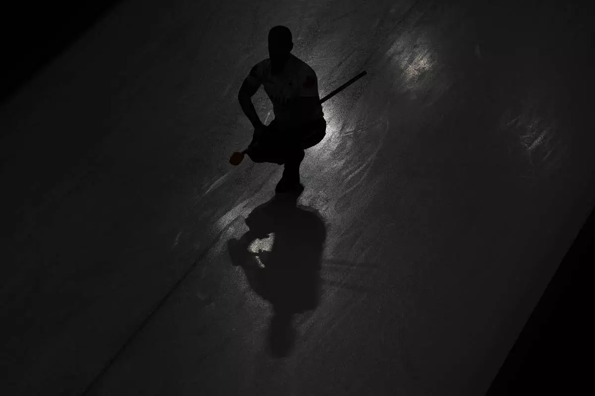 Canada's Brad Jacobs competes during a men's curling semifinal match against Norway at the 2026 Winter Olympics, in Cortina d'Ampezzo, Italy, Thursday, Feb. 19, 2026. (AP Photo/Bernat Armangue)