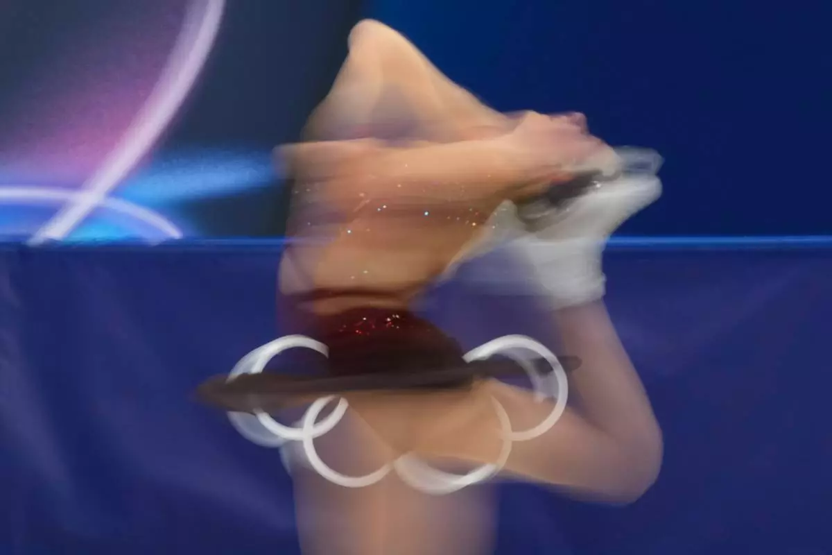 Lorine Schild of France competes during the women's figure skating free program at the 2026 Winter Olympics, in Milan, Italy, Thursday, Feb. 19, 2026. (AP Photo/Natacha Pisarenko)