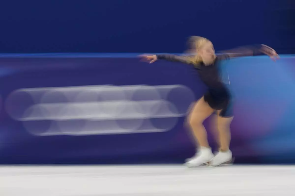 Amber Glenn of the United States competes during the women's figure skating free program at the 2026 Winter Olympics, in Milan, Italy, Thursday, Feb. 19, 2026. (AP Photo/Stephanie Scarbrough)