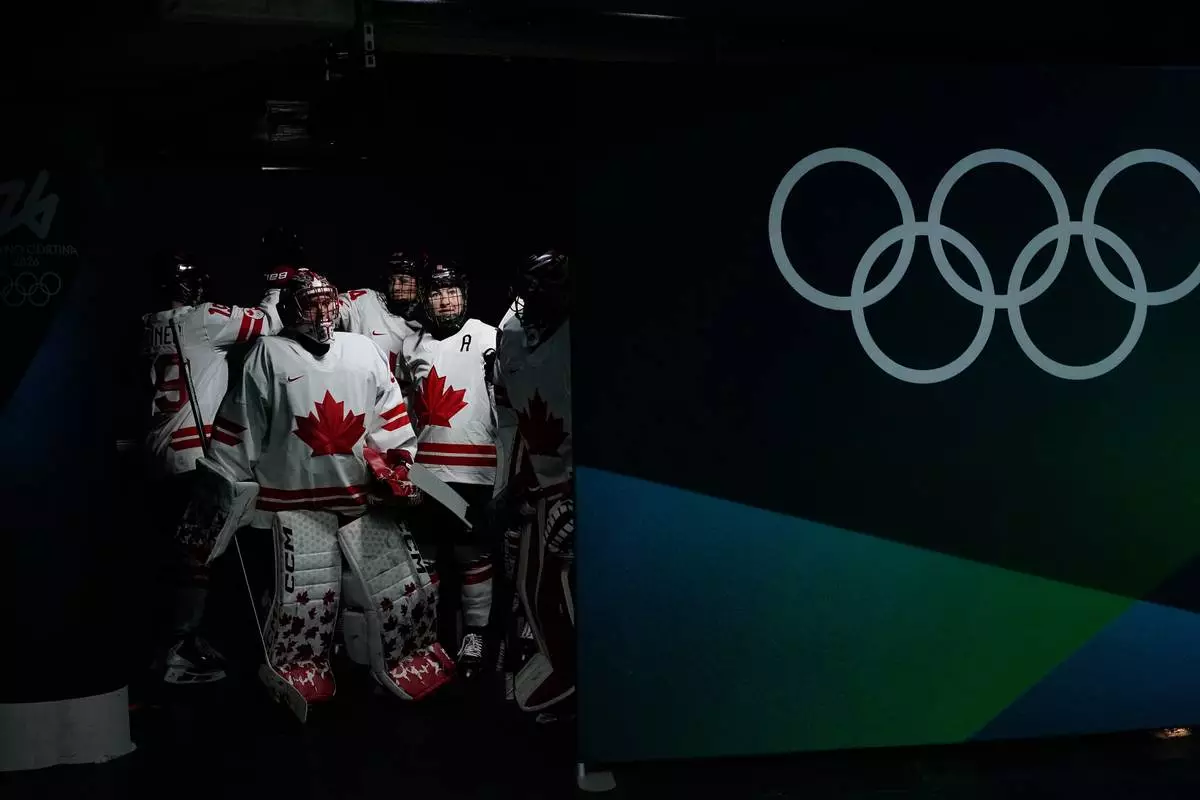 Canada's players arrive for the warm up ahead of a women's ice hockey gold medal game between the United States and Canada at the 2026 Winter Olympics, in Milan, Italy, Thursday, Feb. 19, 2026. (AP Photo/Petr David Josek)
