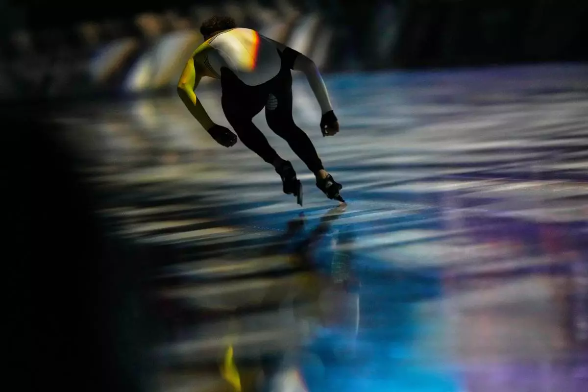 Mathias Voste of Belgium warms up prior to competing in the men's 1500 meters speedskating race at the 2026 Winter Olympics, in Milan, Italy, Thursday, Feb. 19, 2026. (AP Photo/Luca Bruno)