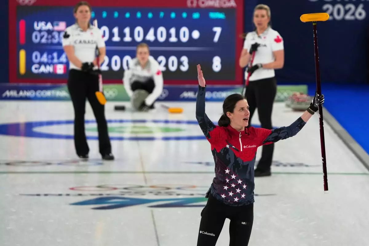 United States' Tara Peterson reacts during the women's curling round robin session against Canada, at the 2026 Winter Olympics, in Cortina d'Ampezzo, Italy, Friday, Feb. 13, 2026. (AP Photo/Misper Apawu)