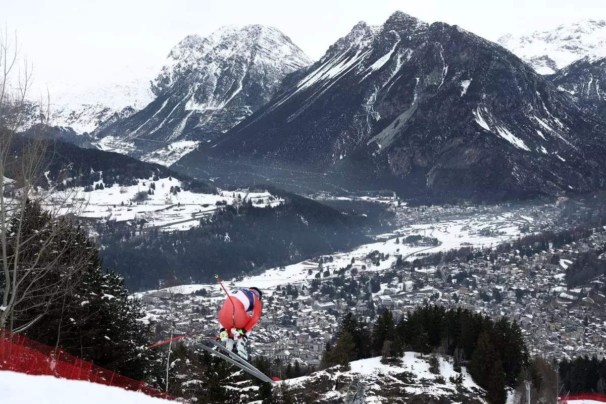 Switzerland's Franjo von Allmen speeds down the course during an alpine ski, men's downhill official training, at the 2026 Winter Olympics, in Bormio, Italy, Friday, Feb. 6, 2026. (AP Photo/Gabriele Facciotti)