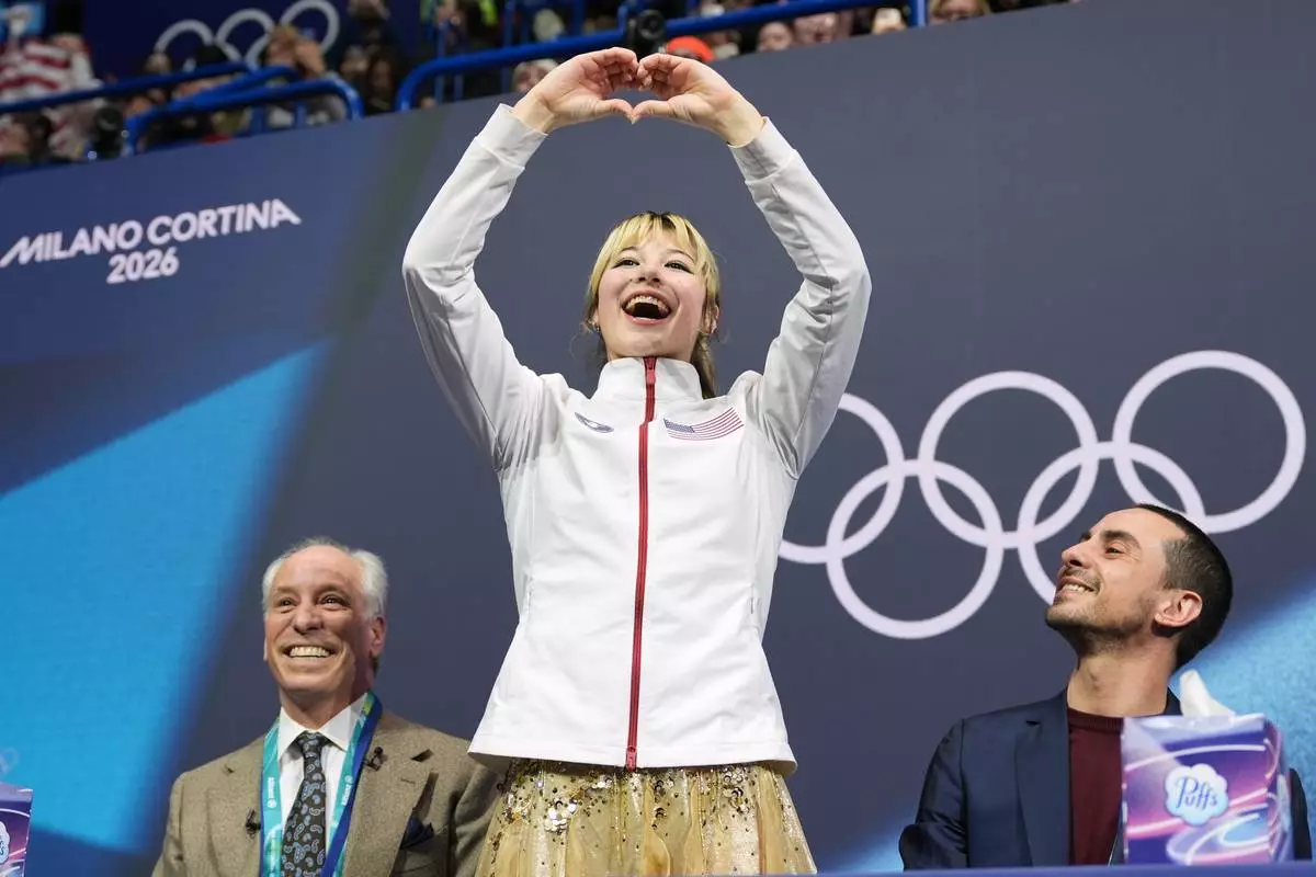 Alysa Liu of the United States reacts to her score after competing in the women's figure skating free program at the 2026 Winter Olympics, in Milan, Italy, Thursday, Feb. 19, 2026. (AP Photo/Stephanie Scarbrough)