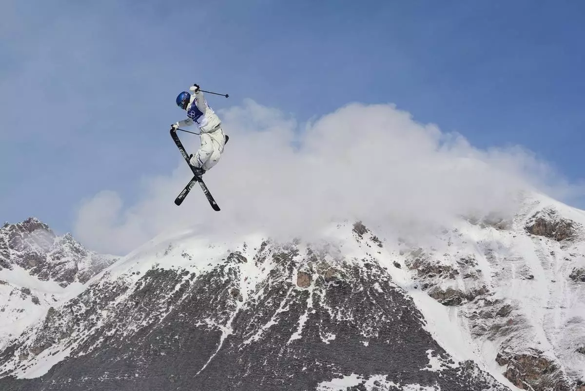 FILE - China's Eileen Gu practices during a freestyle skiing slopestyle training session at the 2026 Winter Olympics, in Livigno, Italy, Feb. 5, 2026. (AP Photo/Lindsey Wasson, File)