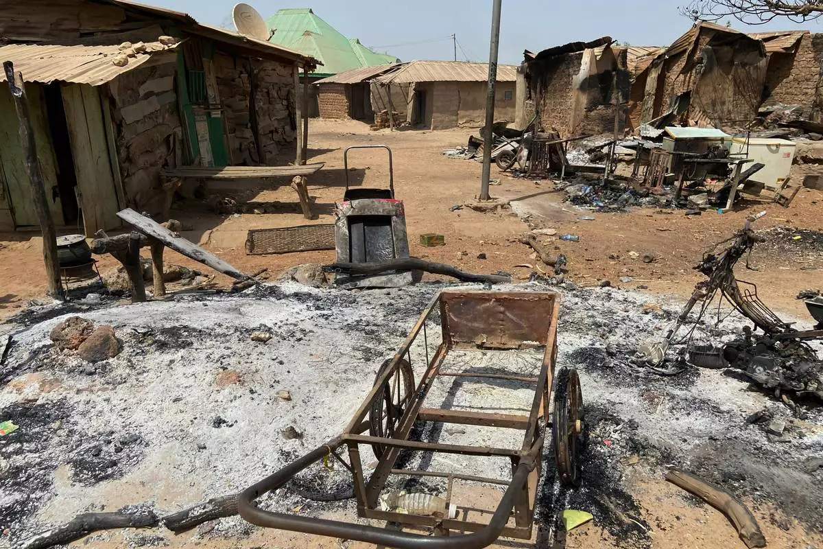 FILE - Razed homes are seen days after an attack that left dozens dead in the Muslim-majority village of Woro, Nigeria, Feb. 5, 2026, that officials said was targeted for refusing extremist ideology. (AP Photo/Musa Salim, File)