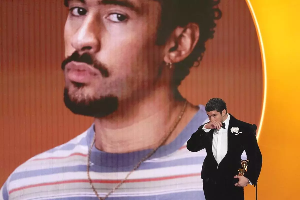 FILE - Bad Bunny accepts the award for album of the year for "Debí Tirar Más Fotos" during the 68th annual Grammy Awards in Los Angeles, Feb. 1, 2026. (AP Photo/Chris Pizzello, File)