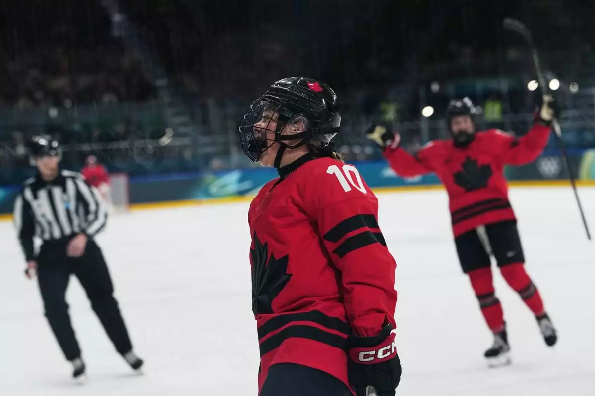 Canada's Sarah Fillier (10) reacts after scoring a goal in the first period against Czechia during a preliminary round match of women's ice hockey at the 2026 Winter Olympics, in Milan, Italy, Monday, Feb. 9, 2026. (AP Photo/Carolyn Kaster)