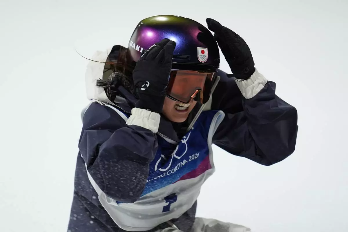 Japan's Kokomo Murase reacts during the women's snowboarding big air finals at the 2026 Winter Olympics, in Livigno, Italy, Monday, Feb. 9, 2026. (AP Photo/Abbie Parr)