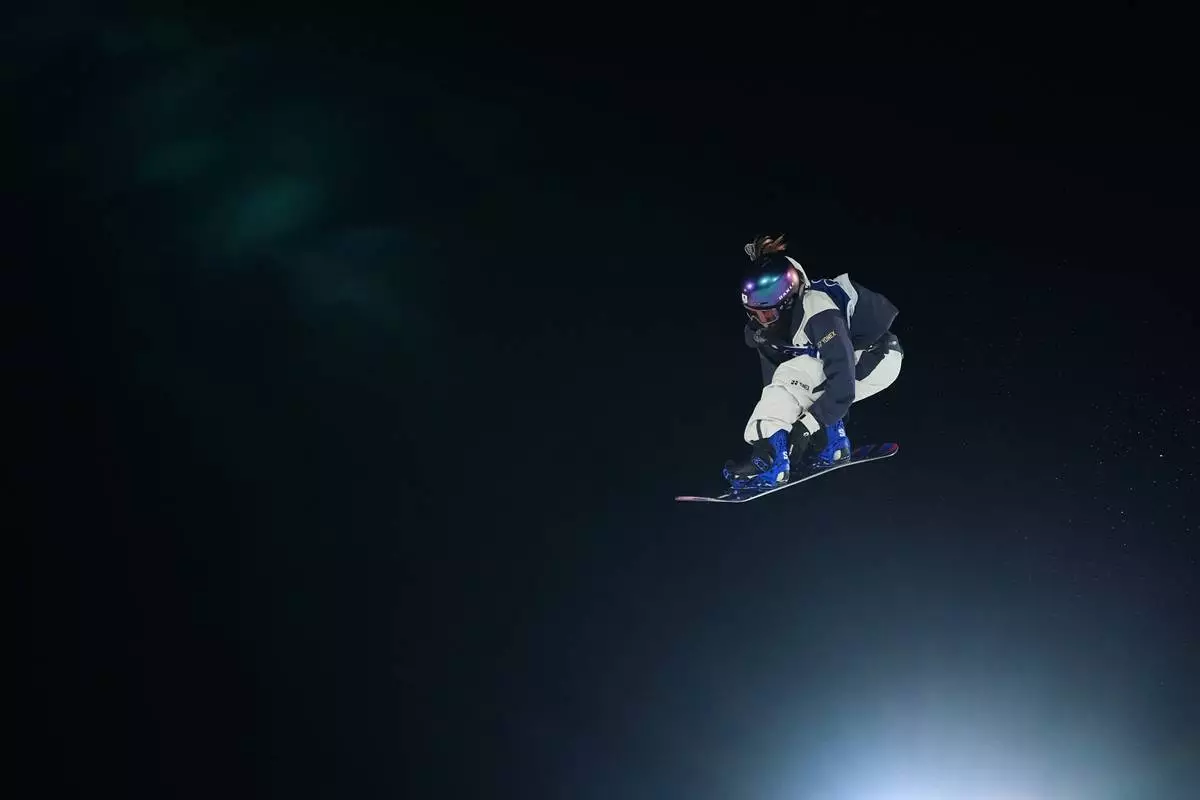 Japan's Kokomo Murase competes during the women's snowboarding big air finals at the 2026 Winter Olympics, in Livigno, Italy, Monday, Feb. 9, 2026. (AP Photo/Gregory Bull)