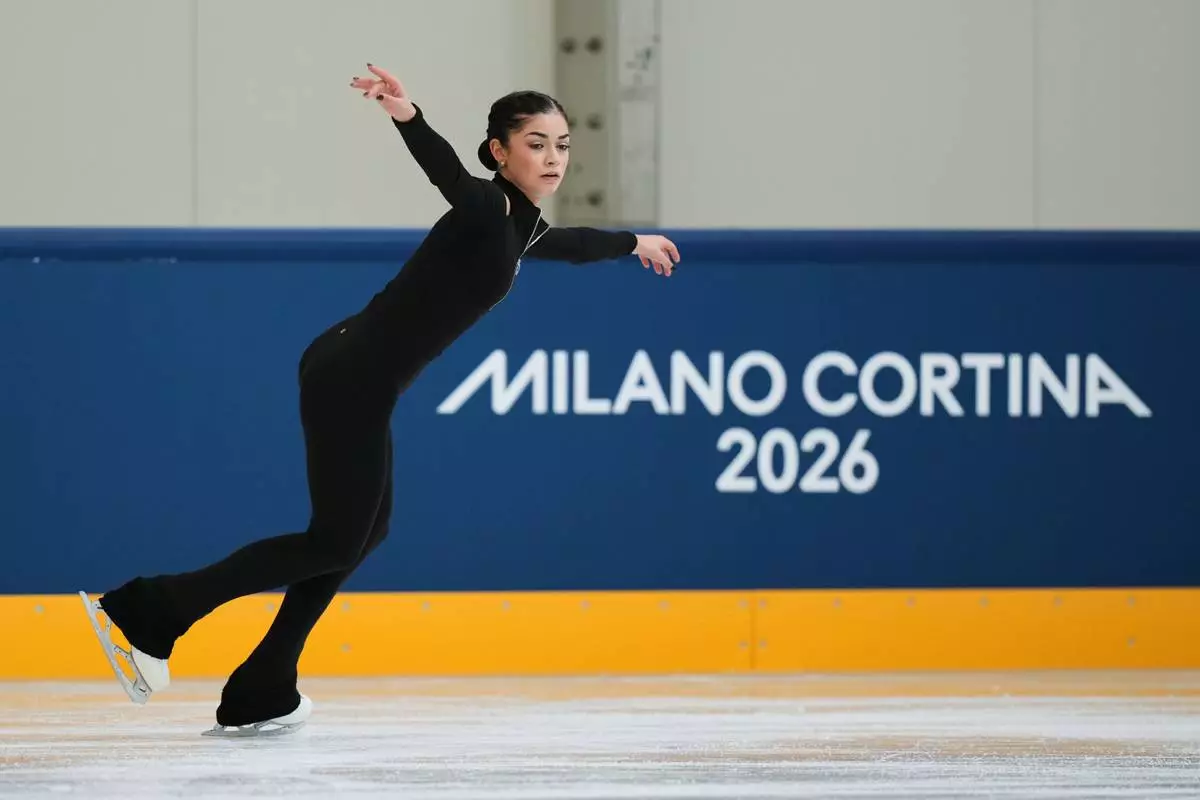 Individual Neutral Athlete Adeliia Petrosian skates during a figure skating practice session at the 2026 Winter Olympics, in Milan, Italy, Monday, Feb. 16, 2026. (AP Photo/Stephanie Scarbrough)