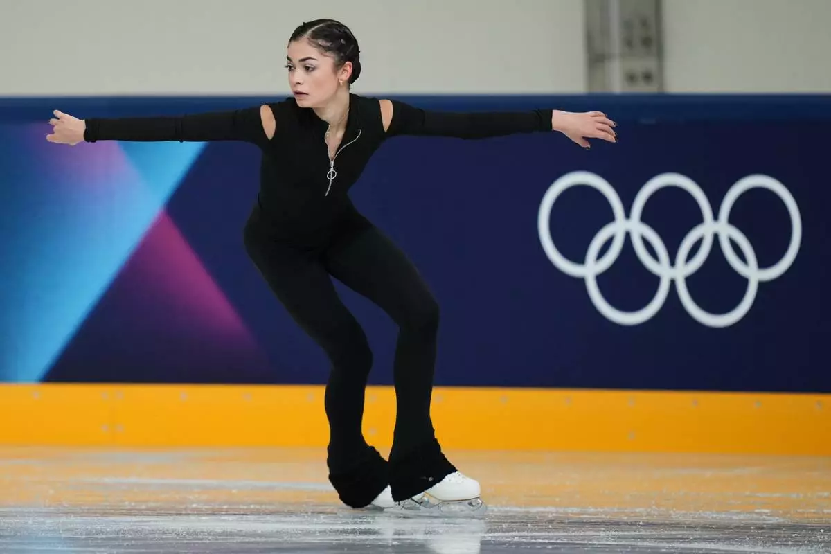 Individual Neutral Athlete Adeliia Petrosian skates during a figure skating practice session at the 2026 Winter Olympics, in Milan, Italy, Monday, Feb. 16, 2026. (AP Photo/Stephanie Scarbrough)