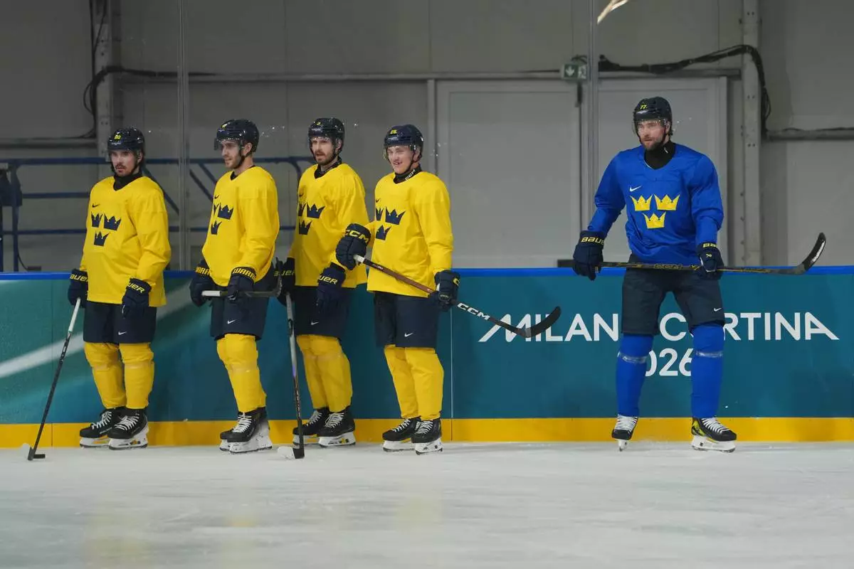 From left, Sweden's Marcus Johansson, Alexander Wennberg, Oliver Ekman-Larsson, Pontus Holmberg, and Victor Hedman stand on the ice during men's ice hockey practice at the 2026 Winter Olympics, in Milan, Italy, Sunday, Feb. 8, 2026. (AP Photo/Carolyn Kaster)