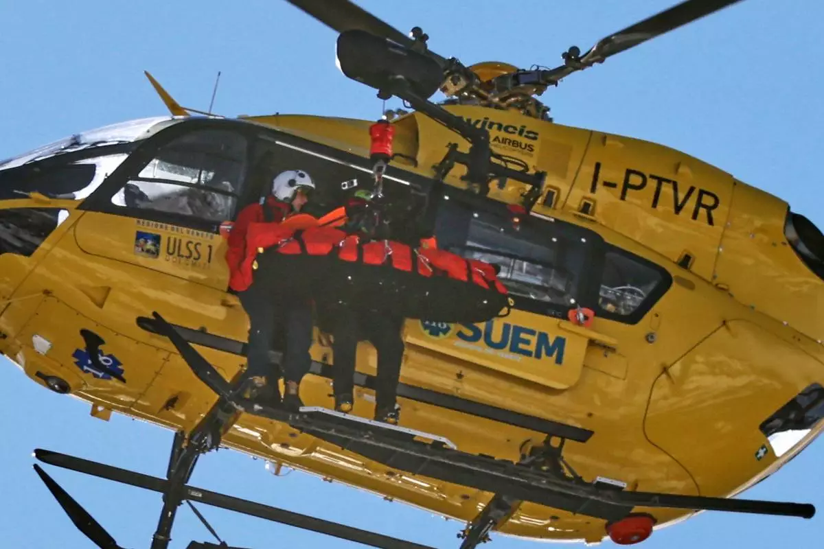 United States' Lindsey Vonn is helicoptered off after crashing, during an alpine ski women's downhill race, at the 2026 Winter Olympics, in Cortina d'Ampezzo, Italy, Sunday, Feb. 8, 2026. (AP Photo/Marco Trovati)
