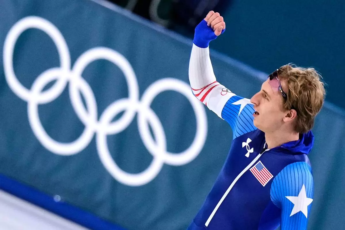 Gold medallist Jordan Stolz of the U.S. celebrates after the men's 500 meters speedskating race at the 2026 Winter Olympics, in Milan, Italy, Saturday, Feb. 14, 2026. (AP Photo/Luca Bruno)